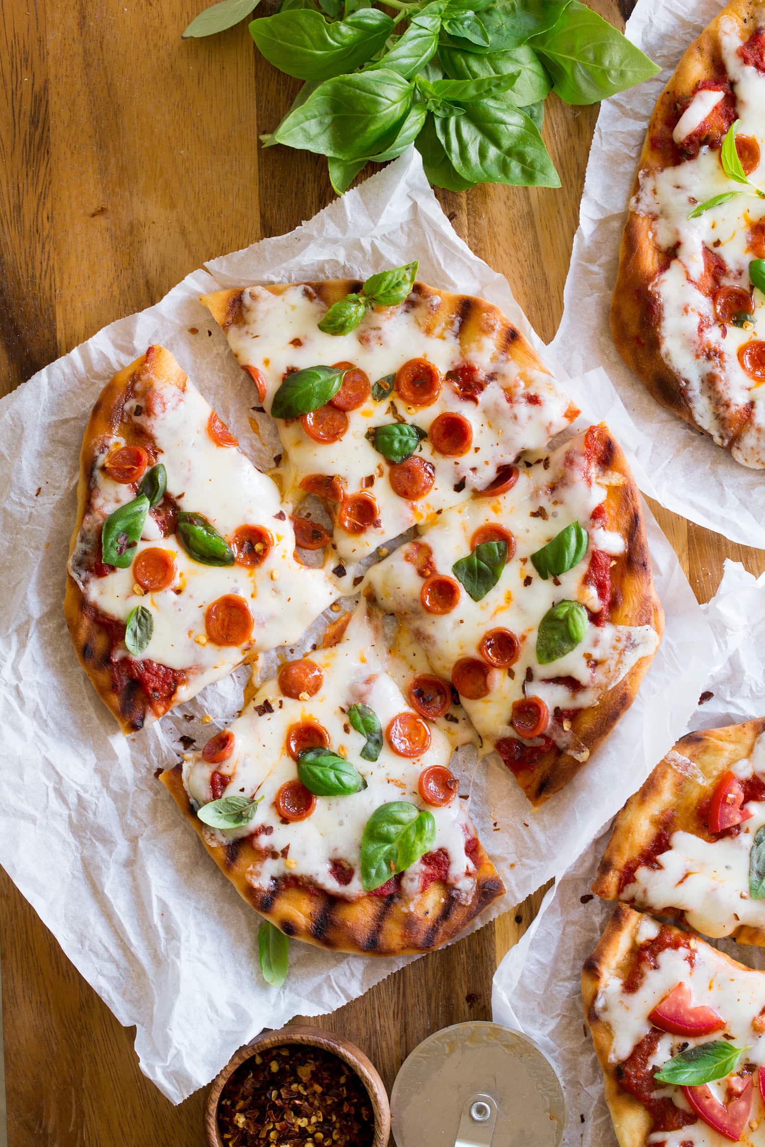 Grilled pizza cut into slices.