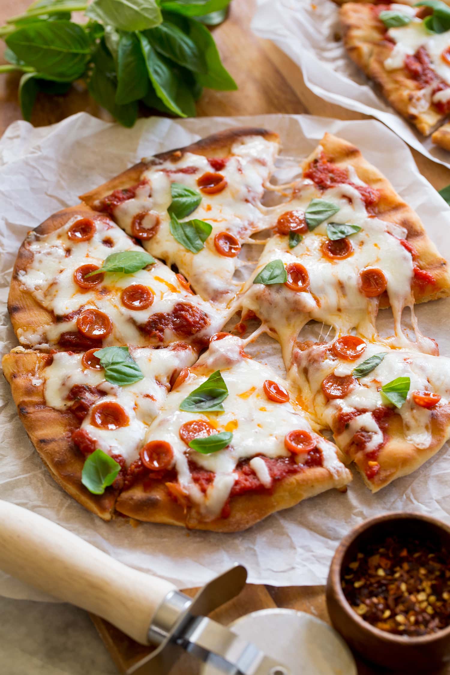 Close up photo of homemade grilled pizza with homemade crust and sauce.