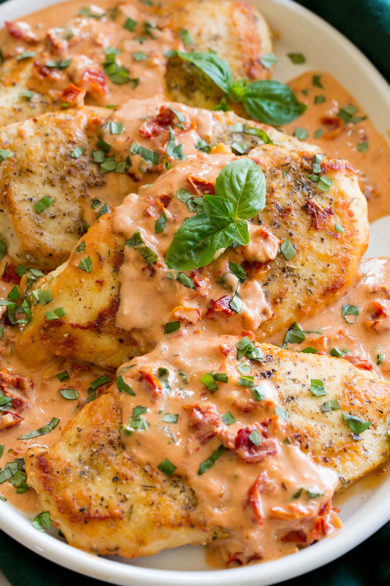 Close up photo of chicken with creamy sun dried tomato sauce.