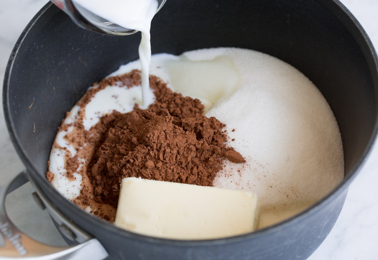 No Bake Cookies mixing sugar cocoa powder butter and milk in saucepan