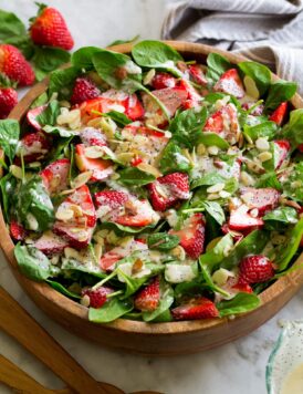 Homemade strawberry spinach salad with easy poppy seed dressing.